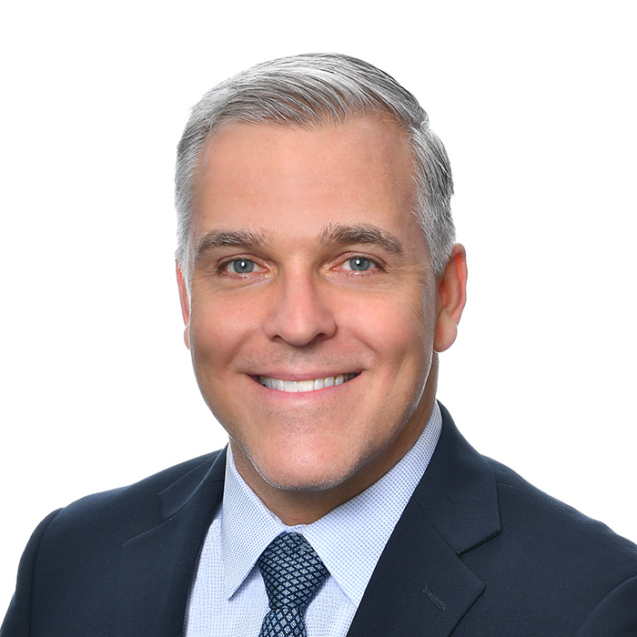 Robert B. Hinckley Jr., Managing Shareholder at Buchalter seen posing for a photo with a bright smile on his face